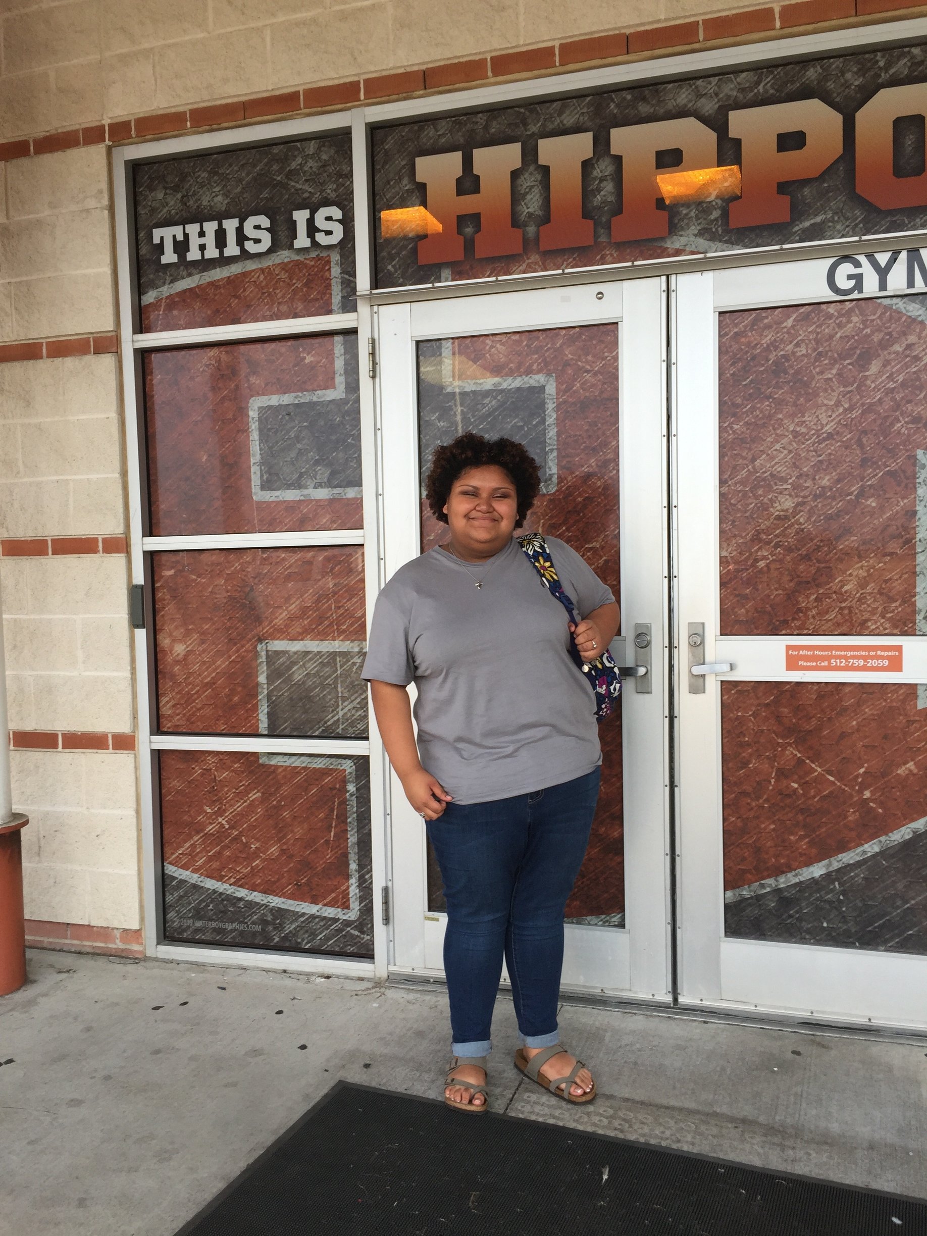 Girl standing in front of doors
